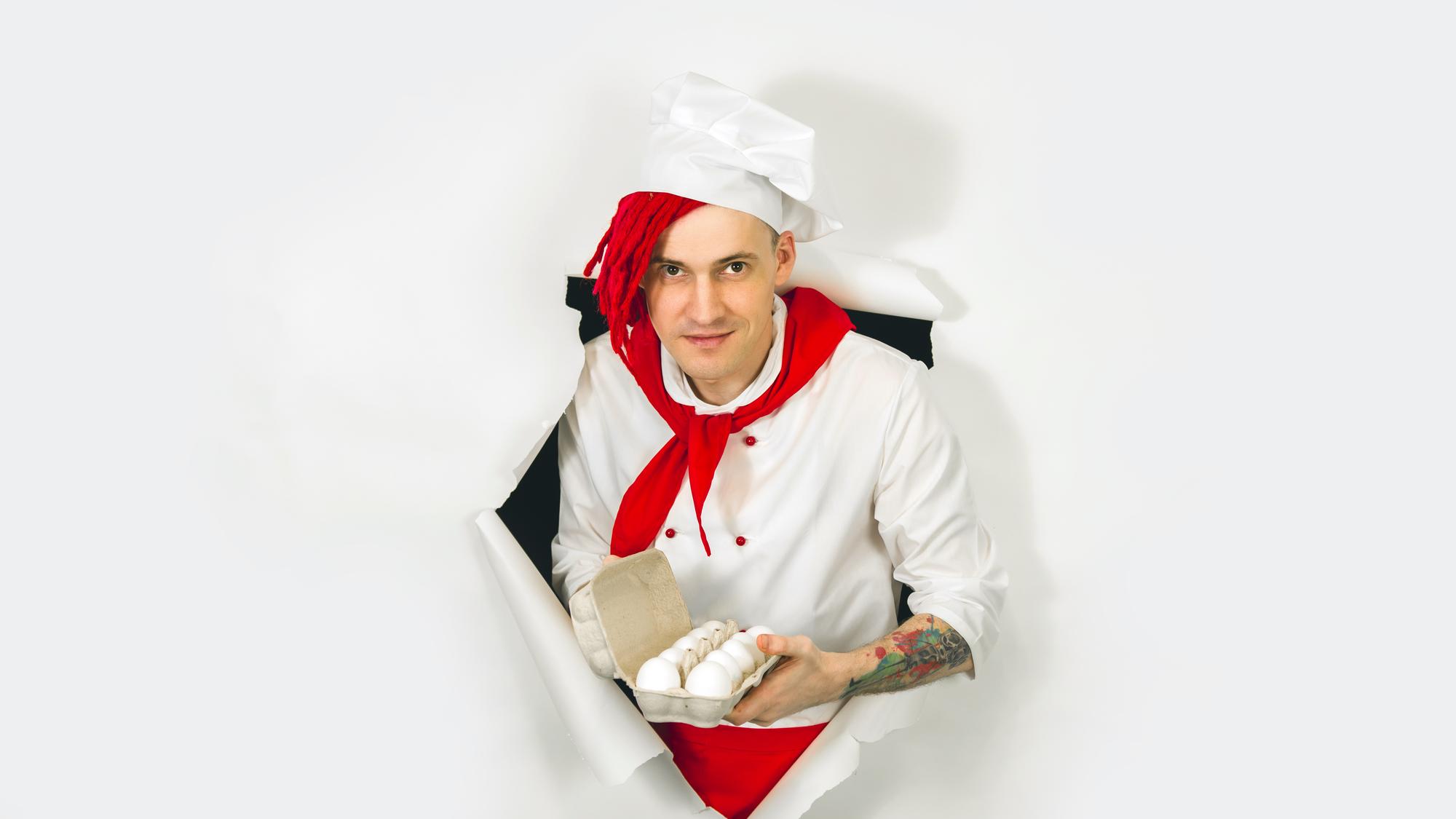 Portrait of pastry chef arranging dessert